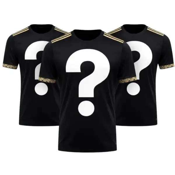 Three mystery jerseys folded in Mystery FC packaging